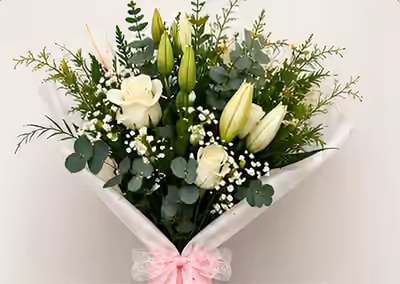 Hand-tied bouquet of white roses, lilies and eucalyptus